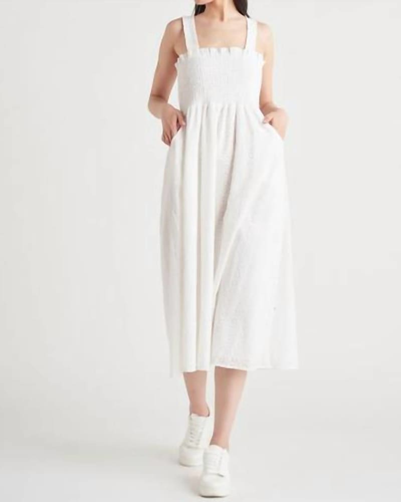 Front of a model wearing a size LARGE Smocked Eyelet Midi Dress In Ivory in Ivory by Dex. | dia_product_style_image_id:346914